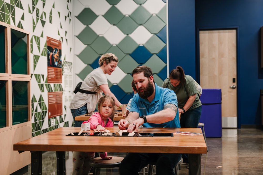 Photo of a father and child engaged in an activity in the ATAS Innovation Studion